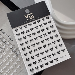 3D embossed black bow nail art stickers with intricate ribbon designs for manicure