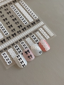Détails d'autocollants 5D pour ongles avec nœuds noirs et textures en dentelle