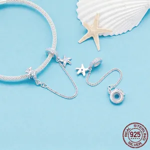 925 sterling silver ocean charm bracelet with starfish and turtle pendants on sea background