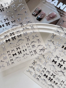Macro detail of black and white bow nail art stickers set showing designs YT6360 and YT6359