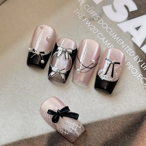 Elegant gold foil bow nail art stickers set with French black tips and pearl details