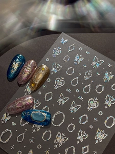 Detail of 3D laser silver butterfly and heart nail stickers on dark manicure design