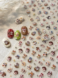 Detail view of 3D embossed nail stickers featuring cute cartoon cats and dogs with embroidery texture