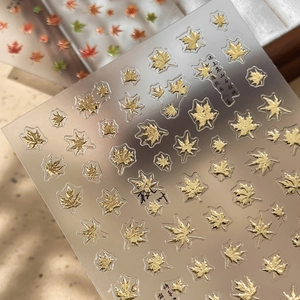 Golden 3D maple leaf nail art stickers with metallic finish and Chinese calligraphy elements
