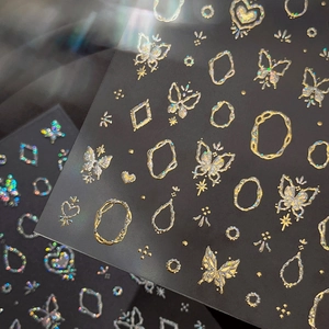 3D embossed butterfly nail stickers with gold holographic laser patterns on black base