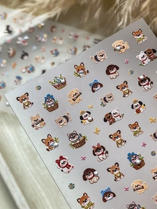 Detailed macro view of 5D embossed nail stickers with cute cartoon puppy motifs