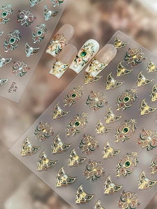 5D Baroque nail stickers featuring gold borders, green gems, and 3D pearl relief textures