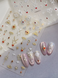 Macro detail of 3D embossed bohemian nail stickers with gold sun and moon motifs