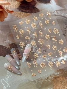 Detail of 5D embossed nail art stickers with gold trim red flowers and pearls YT6682