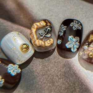 Exquisite 3D white floral nail art stickers with gold relief and marble textures