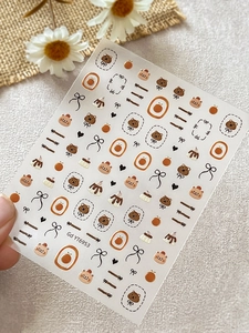 Détail d'autocollants nail art ours mignon et nœud pour décoration de manucure DIY