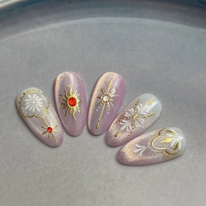 Baroque style cat-eye purple press-on nails with gold sunburst and 3D lace relief