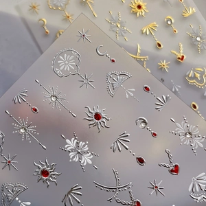 Bohemian 3D embossed nail stickers featuring sun, moon, and stars with metallic finish