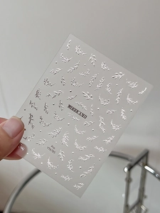 Close-up of Woodland YT6785 silver bronzing nail stickers with metallic leaf patterns