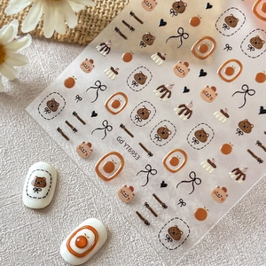 Stickers à ongles mignons ours et nœuds avec des motifs esthétiques orange d'automne
