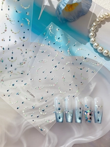 Macro view of YT7124Pro shell laser nail stickers on gradient blue press-on nails