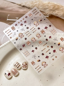 Detailed view of cute cartoon rabbit nail stickers with mushroom and puppy patterns