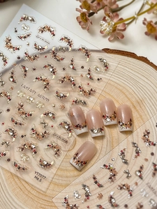 Detailed view of Fantasy Autumn nail stickers with gold maple leaves and rhinestones