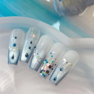 Blue and white gradient press-on nails with silver glitter and butterfly charms