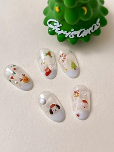 Detail of Christmas jelly nail stickers featuring Santa, reindeer and tree patterns