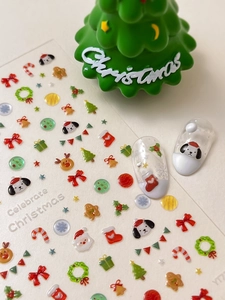 Detailed view of 3D Christmas nail stickers with Santa, reindeer and snowflake patterns