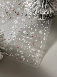Detailed view of 3D embossed Christmas nail stickers with snowflakes and gold trees