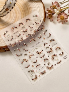 Detail of Fantasy Autumn nail stickers with pine cones, wreaths, and maple leaf patterns