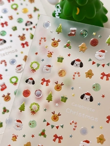 Detail of 3D Christmas resin stickers featuring Santa, reindeer, and snowflakes on a card