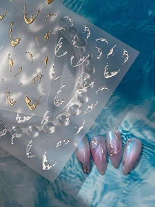 Detailed 3D metallic silver fluid nail stickers applied on gradient pearl nails