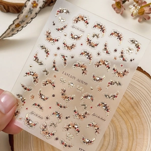 Autumn theme nail stickers with floral wreaths and golden bow accents in retro style