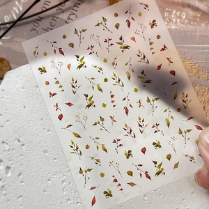 Minimalist fall leaf nail stickers with hand-painted autumn designs for DIY decoration