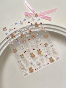 Detail view of cartoon bear nail art stickers with birthday celebration theme and YT7002 model