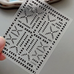 Silver and black geometric nail art stickers with 3D metallic rivet pattern for women