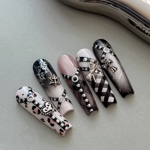 Gothic punk press-on nails with leopard print, checkerboard, and 3D metal heart charms