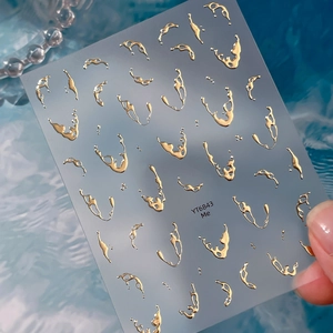 3D metallic gold fluid nail art stickers with liquid water drop effects on blue water background