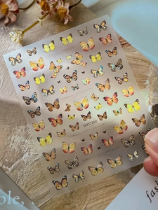 Detailed holographic butterfly nail art stickers with 3D embossed texture for DIY