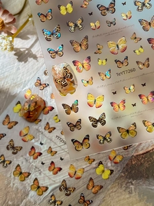 Detailed realistic butterfly nail stickers with gold leopard prints and glitter finish