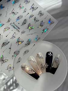 Macro detail of holographic butterfly nail art stickers with 3D effect application
