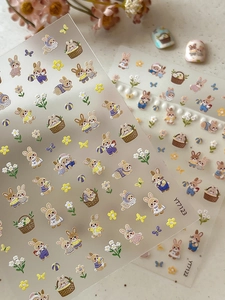 Detailed 5D embossed nail stickers featuring cute cartoon bunnies and floral textures