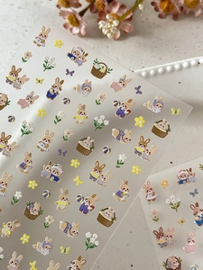 Detailed sheet of embossed rabbit nail art stickers with floral and butterfly motifs