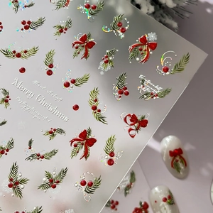 Silver laser 3D Christmas nail stickers with red bows and green pine branch patterns