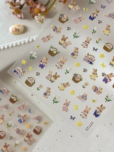 Detailed 5D embossed nail art stickers featuring cute cartoon rabbits and daisy flowers