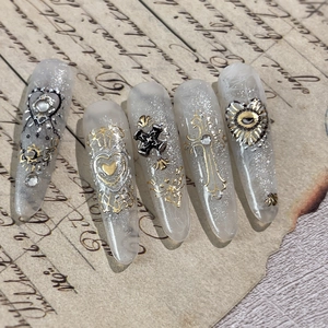Baroque Gothic press-on nails with 3D silver crosses and hearts on vintage paper background