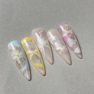 Pastel macaron color press-on nails with 3D lace relief and bow tie pearl decorations