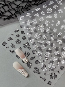 Detailed view of rose nail stickers with rhinestones on 3D embossed floral patterns
