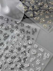 Macro detail of SYT7022 rose nail stickers with gold foil and crystal rhinestone accents