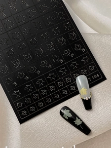 Detailed maple leaf nail stickers with embossed texture on varied manicured nail samples