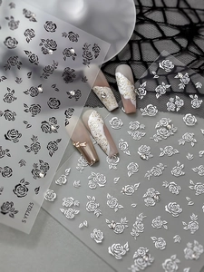 Detailed 5D embossed black and silver rose nail stickers with rhinestones and lace