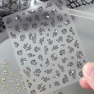 Floral nail art stickers with black roses and crystal rhinestones on a slim film