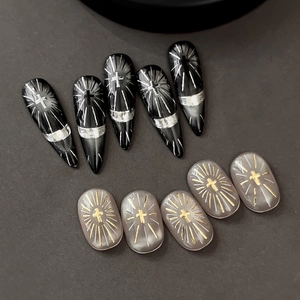Silver and gold cross nail art stickers featuring gothic and elegant designs on a dark base